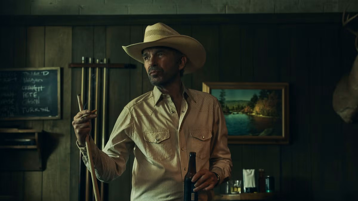 Tommy Norris, standing strong with a pool cue in Landman Season 1, faces cartel threats, betrayal, and family chaos ahead.